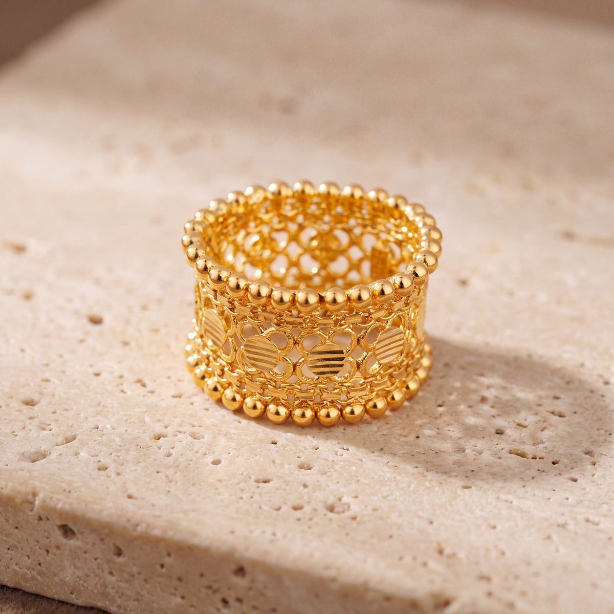 Heritage Ring (D2) on travertine