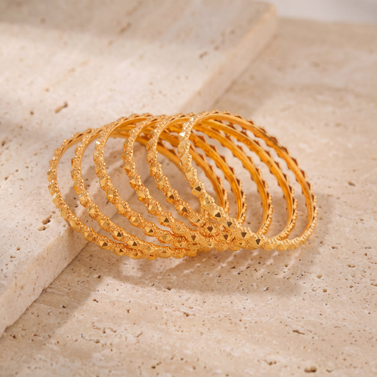 Kid's Bangles (D17-N) on travertine stone