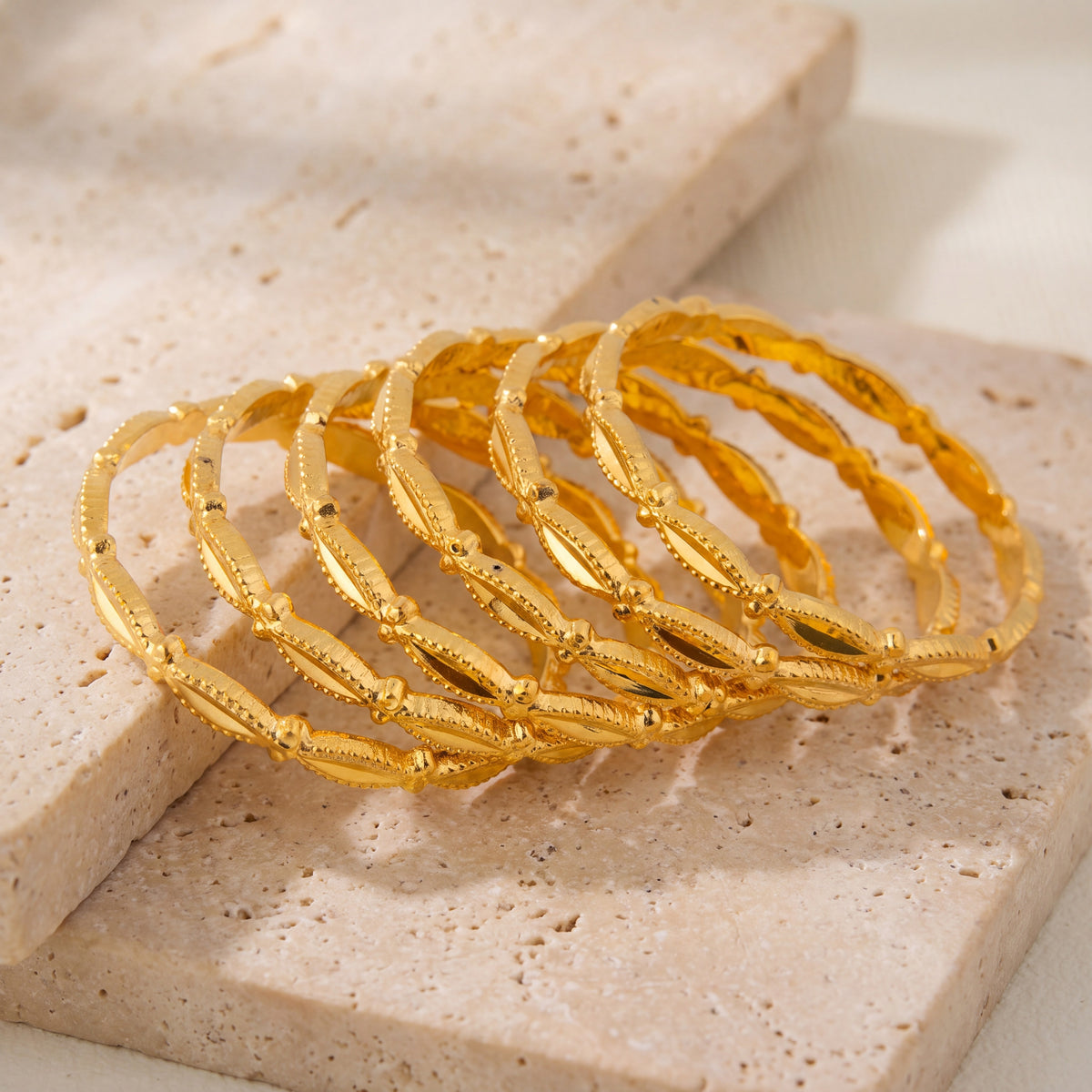 Kid's Bangles (D24-K) on travertine stone