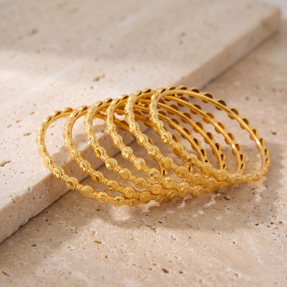 Kid's Bangles (D25-K) on travertine stone