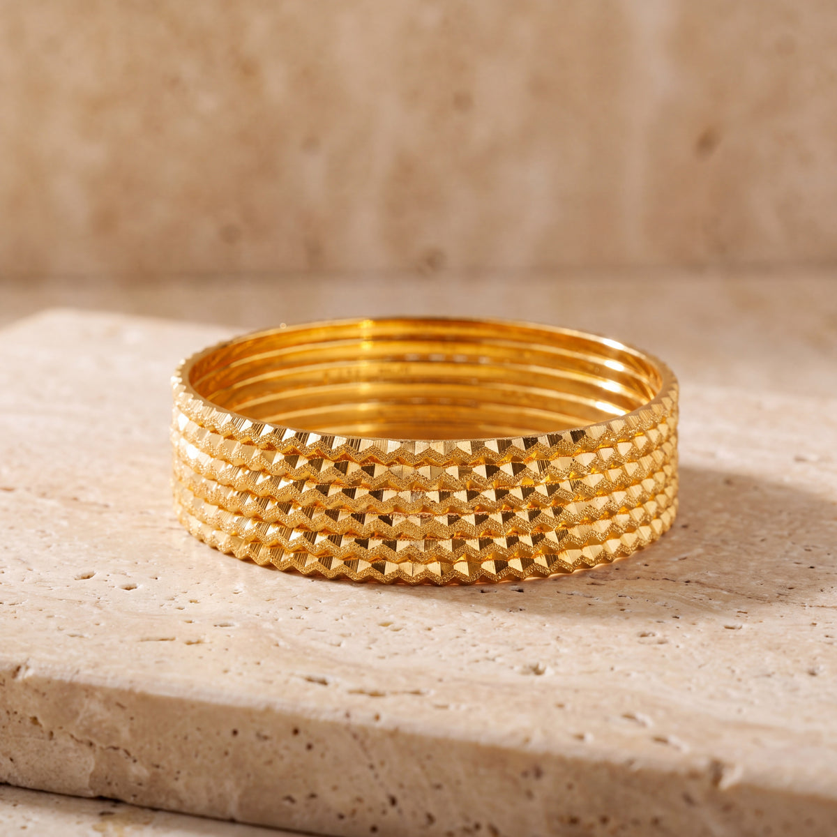 Laser Bangle (KD1) on travertine