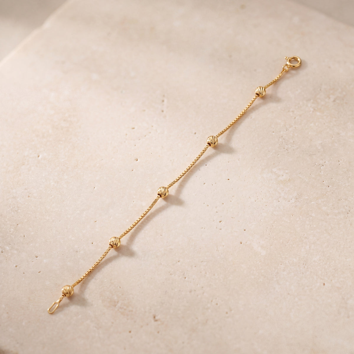 Light Weight Bracelet (D1) on travertine
