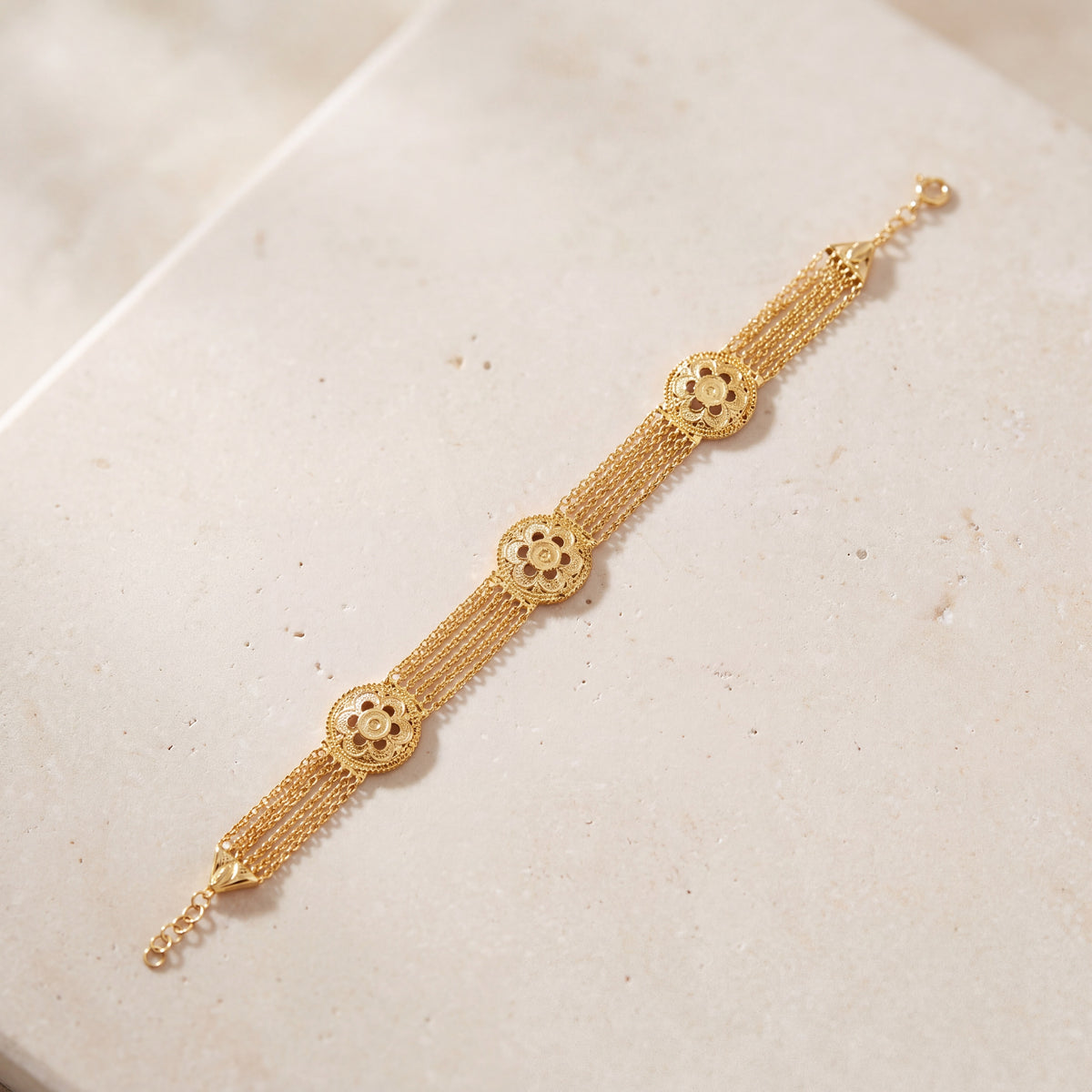 Linked Floral Bracelet (D1) on travertine
