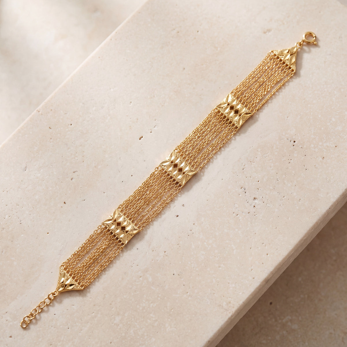 Linked Squares Bracelet (D1) on travertine