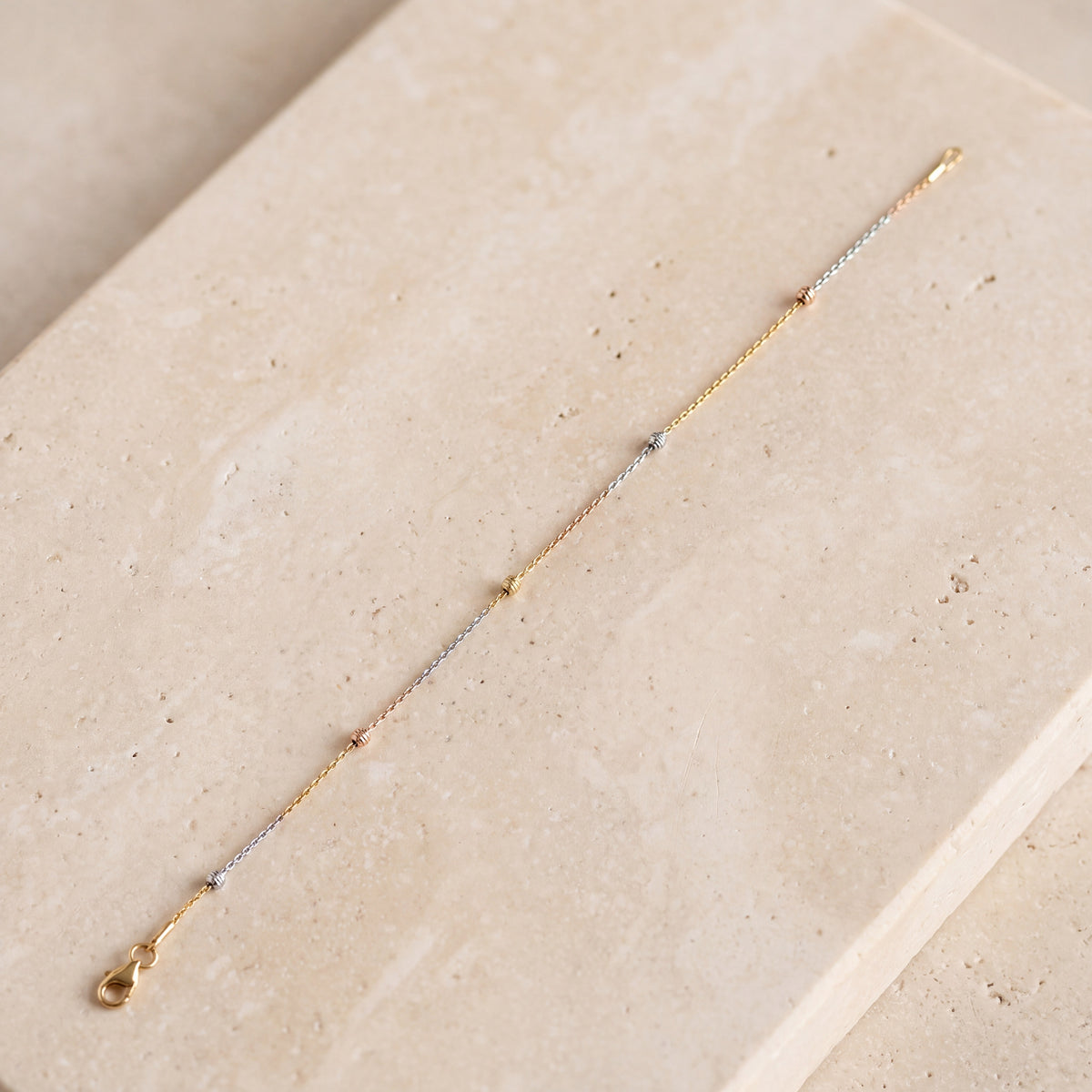 Multi Color Bracelet (D10) on travertine