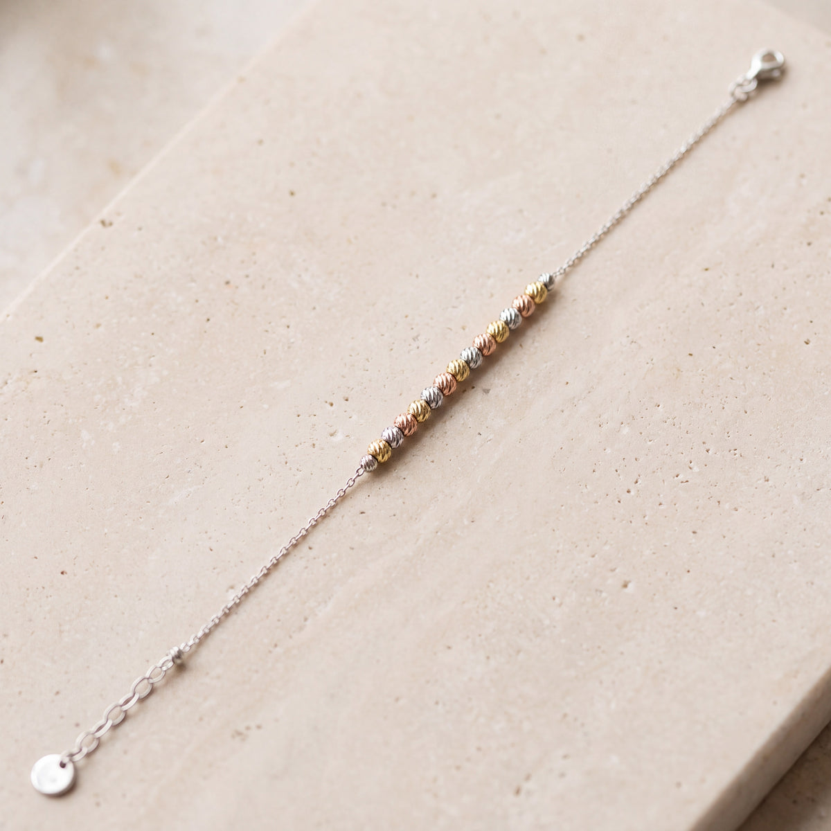 Multi Color Bracelet (D4) on travertine
