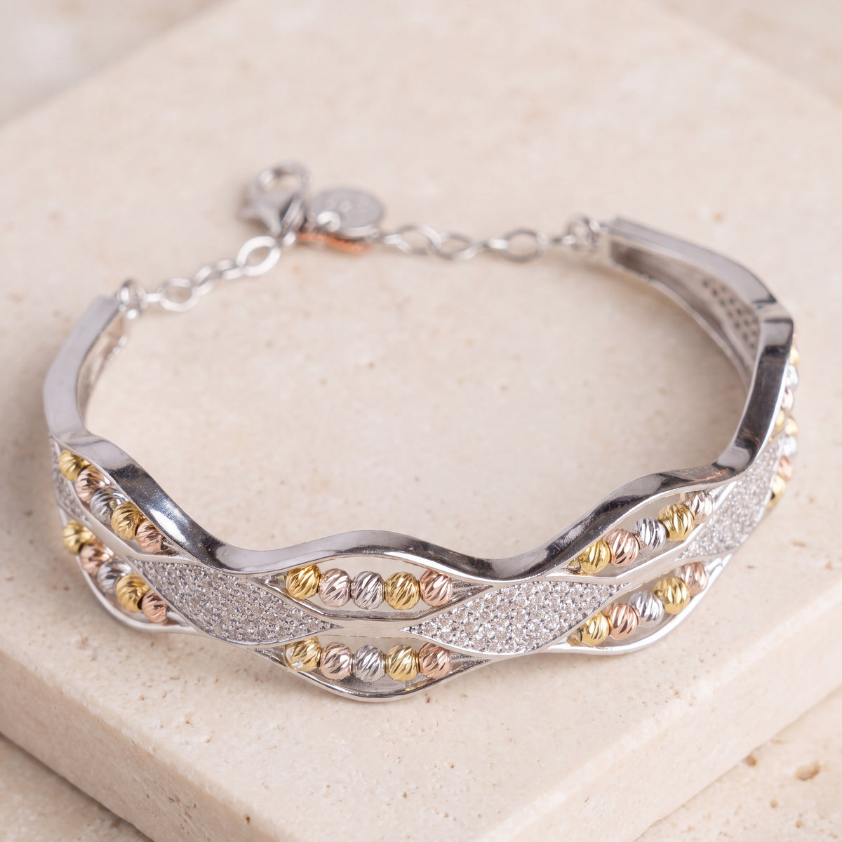 Multi Color Cuff Bracelet (D16) on travertine