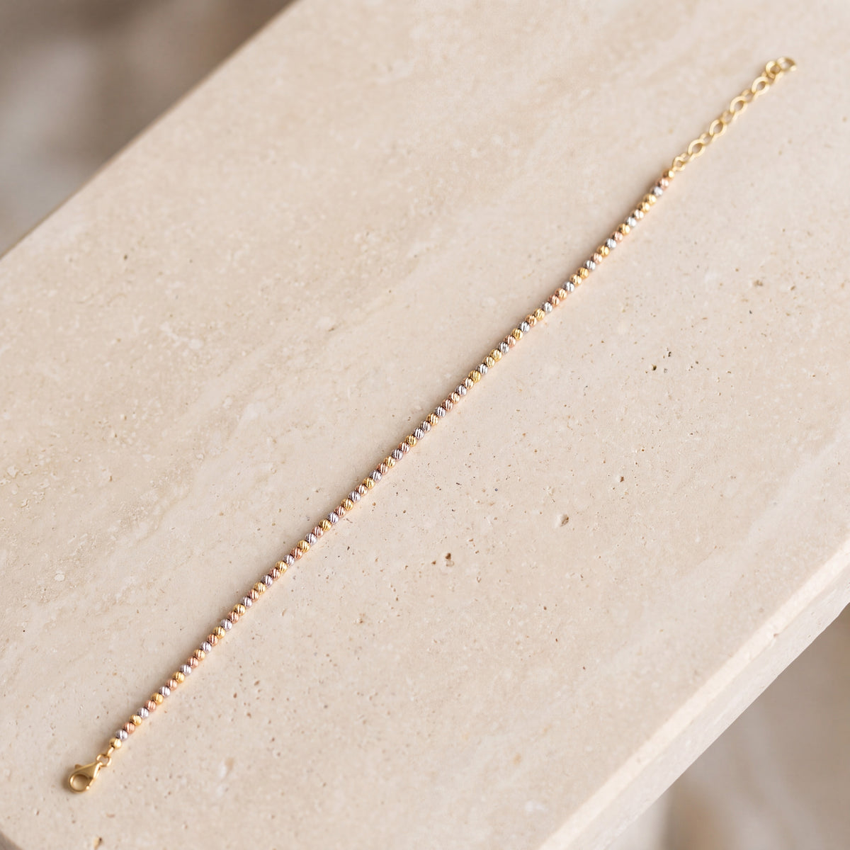 Multi Color Dorika Bracelet (D1) on travertine