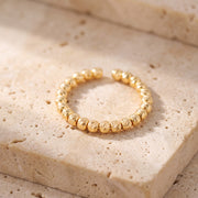 Open Bead Ring (1 Line) on travertine