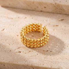 Open Bead Ring (3 Line) on travertine