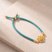 Pointed Star Thread Bracelet on travertine