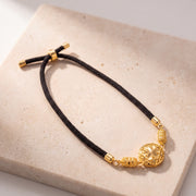 Quatrefoil Thread Bracelet on travertine