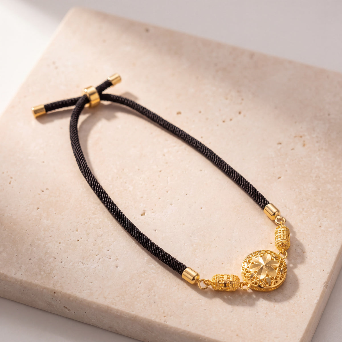 Quatrefoil Thread Bracelet on travertine