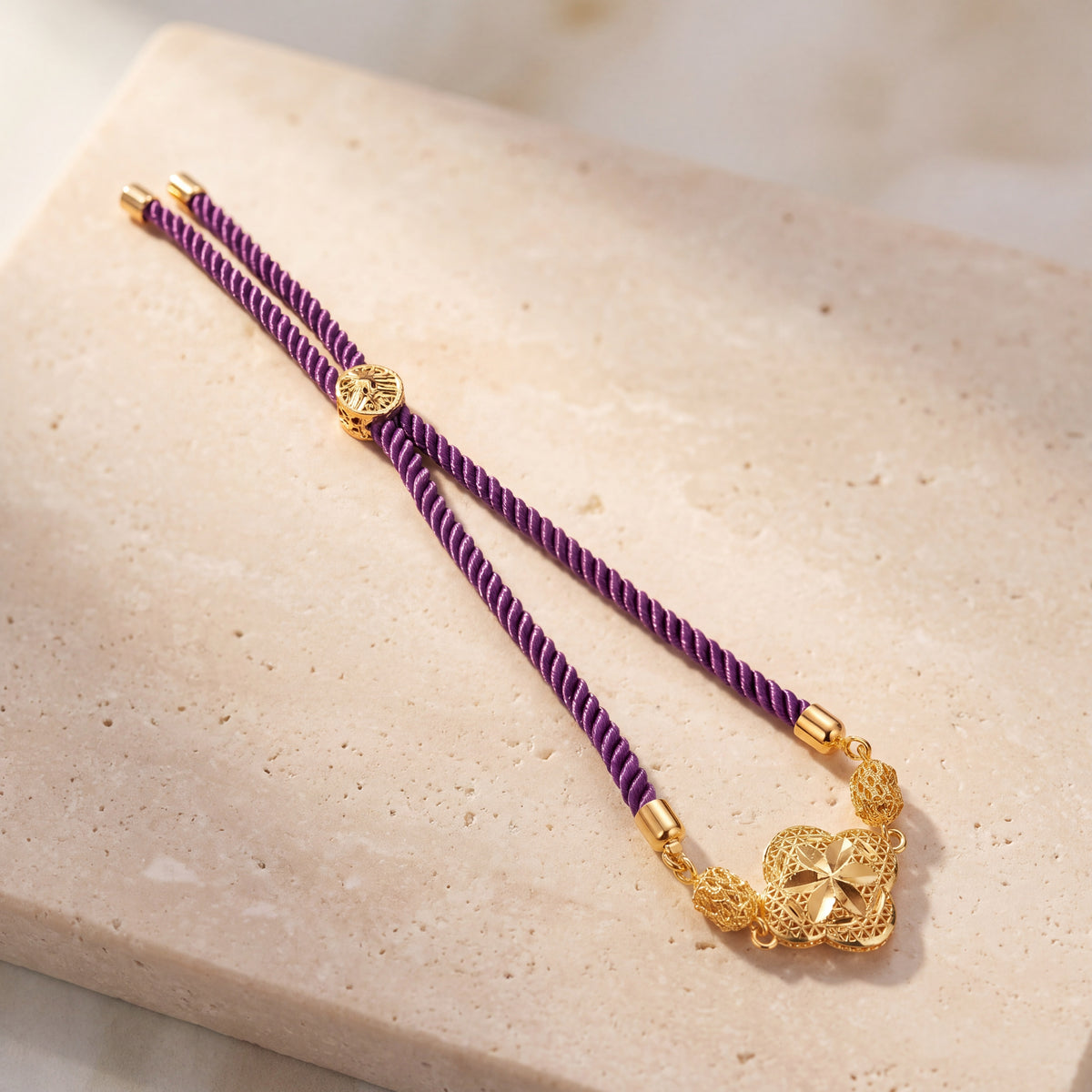 Quatrefoil Thread Bracelet on travertine