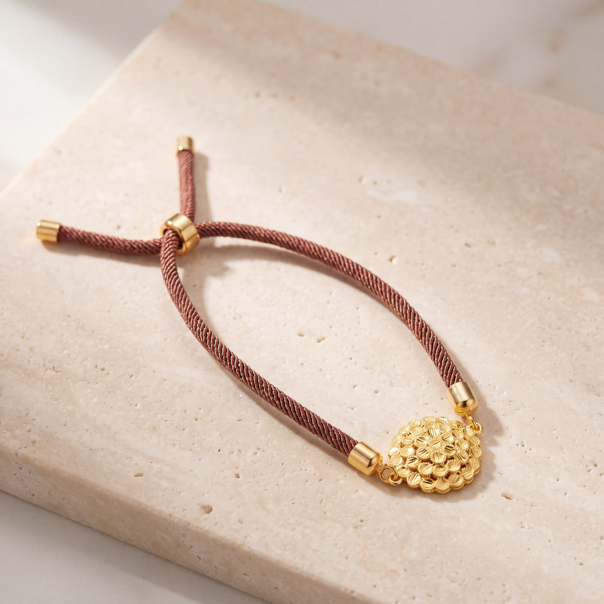 Round Grape Thread Bracelet on travertine