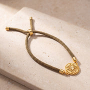 Round Leaf Thread Bracelet on travertine