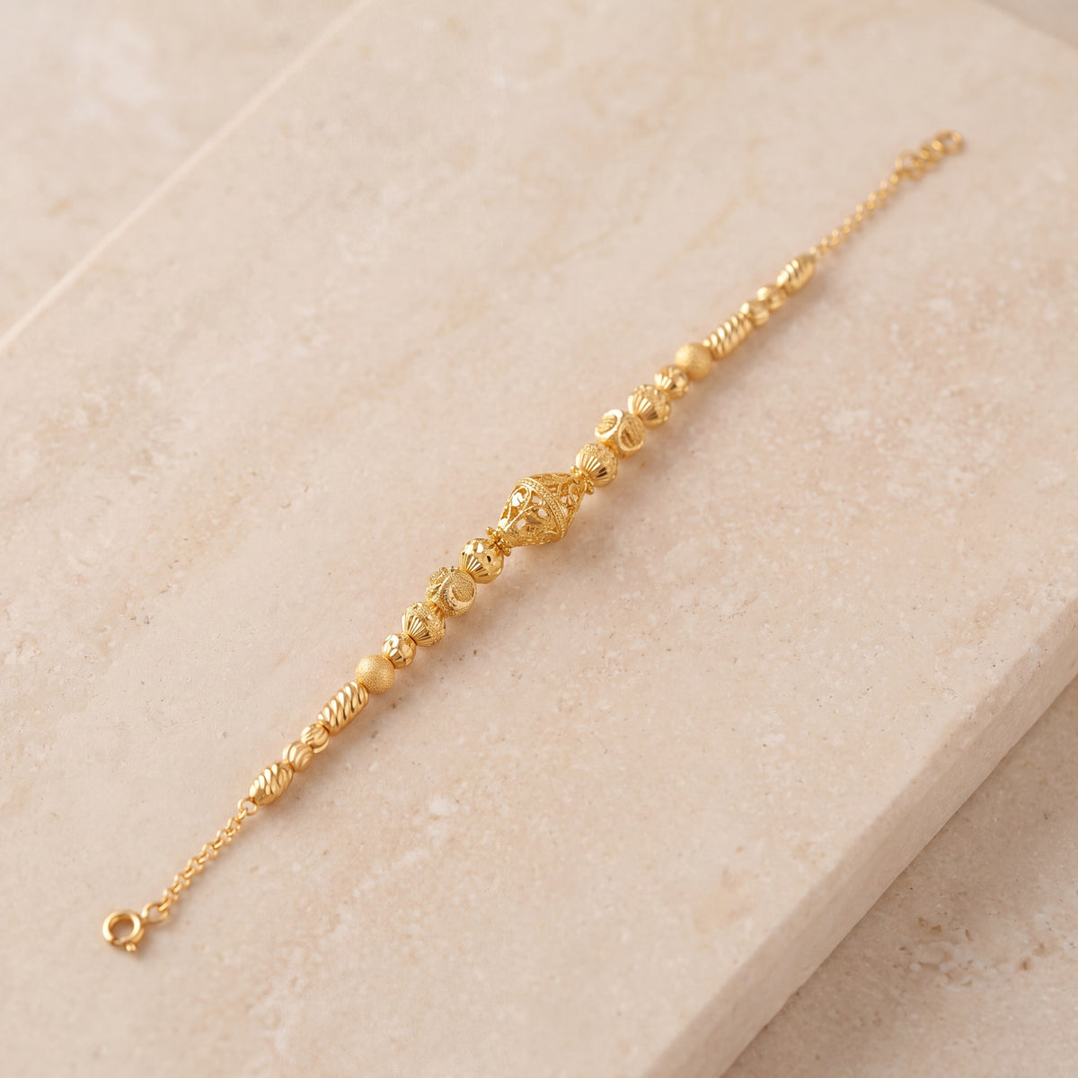 RP Beads & Ball Bracelet (D104) on travertine