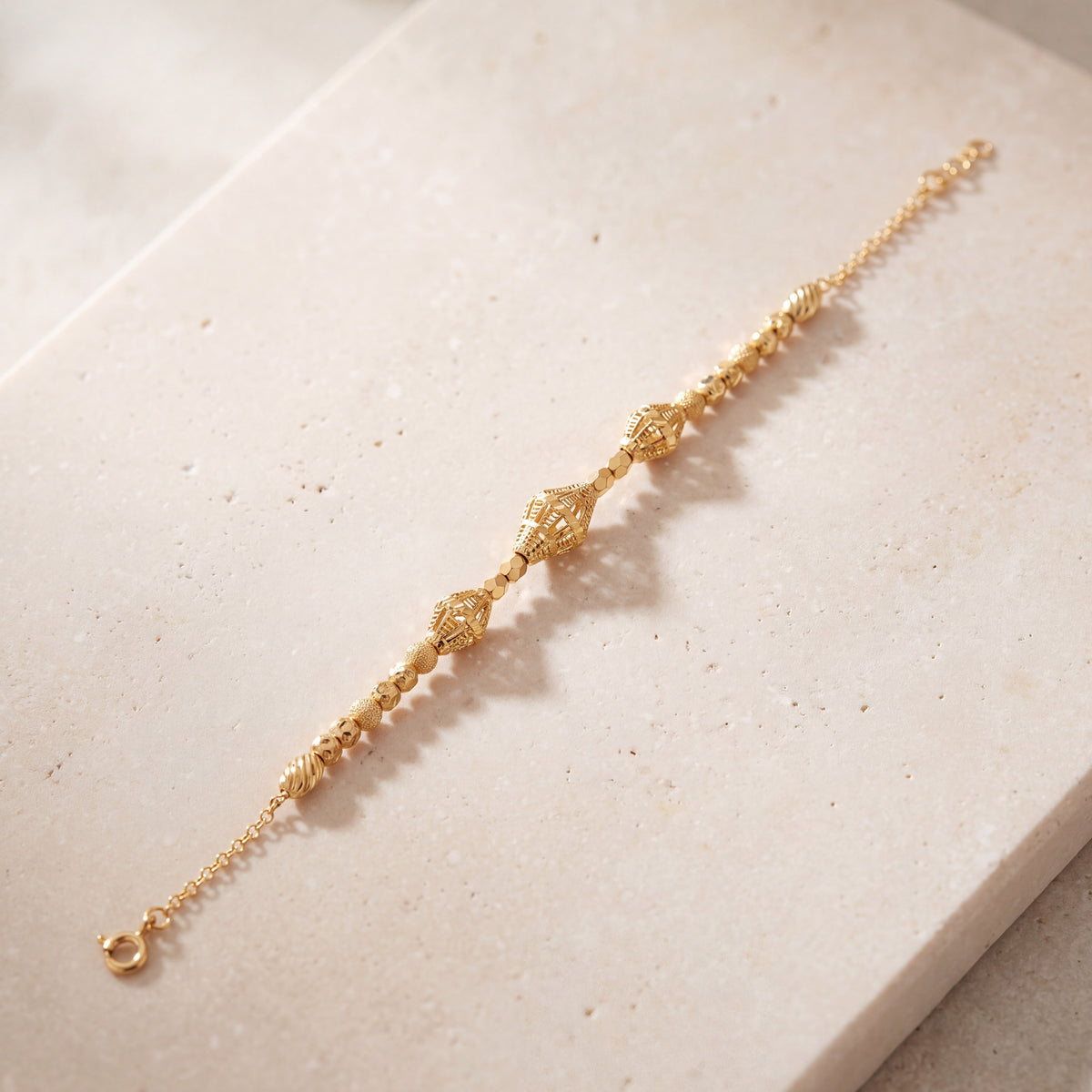 RP Beads & Ball Bracelet (D108) on travertine