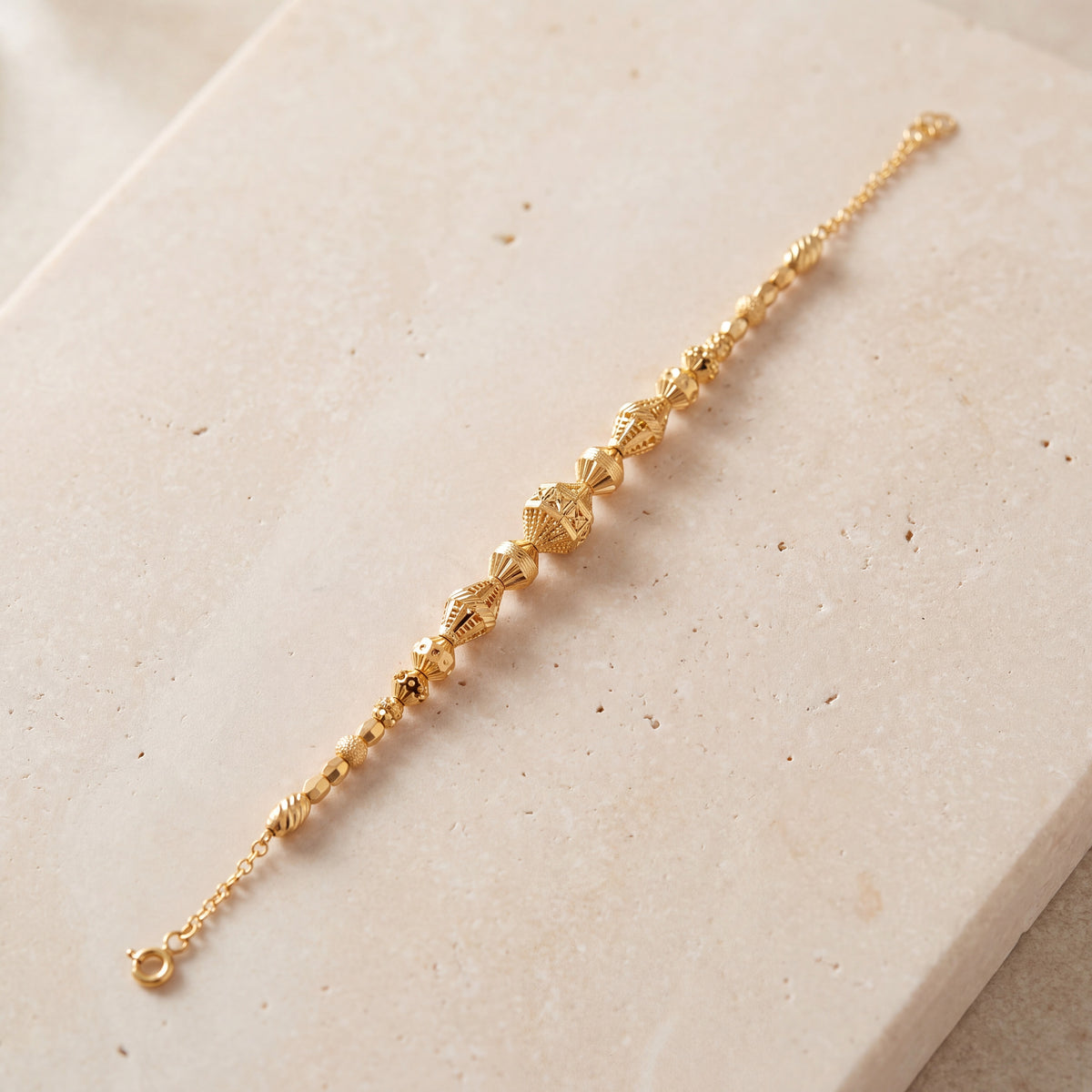 RP Beads & Ball Bracelet (D112) on travertine