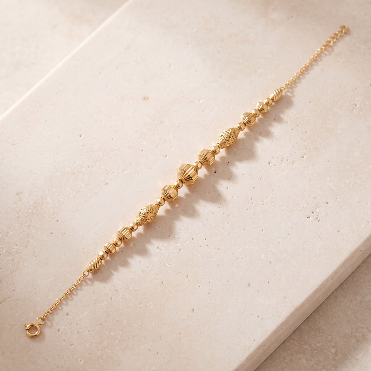 RP Beads & Ball Bracelet (D113) on travertine