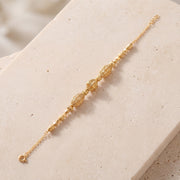 RP Beads & Ball Bracelet (D116) on travertine