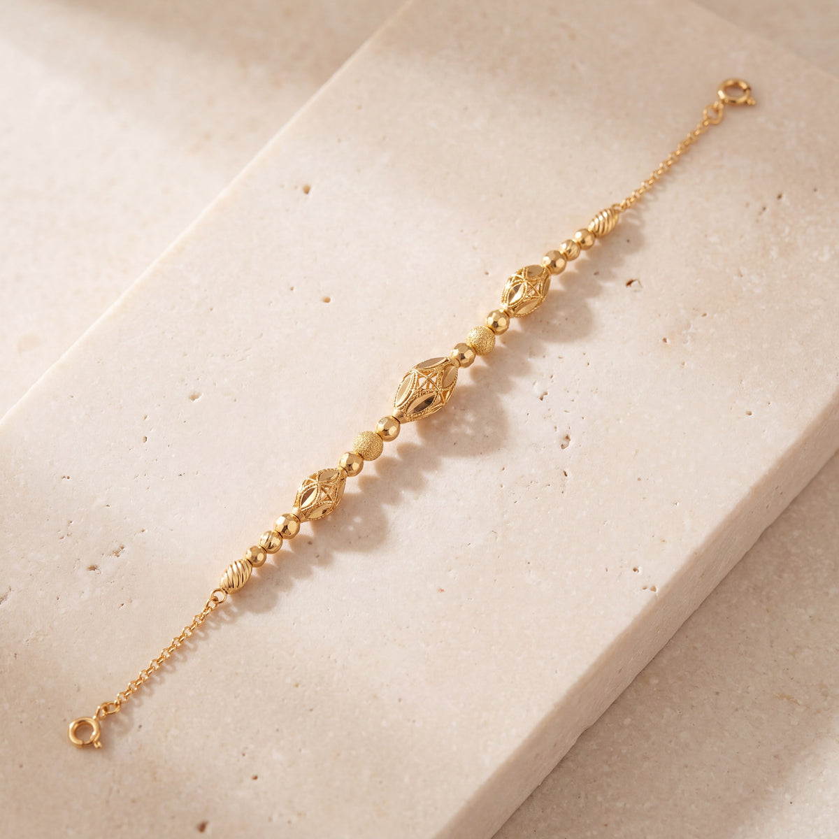 RP Beads & Ball Bracelet (D121) on travertine