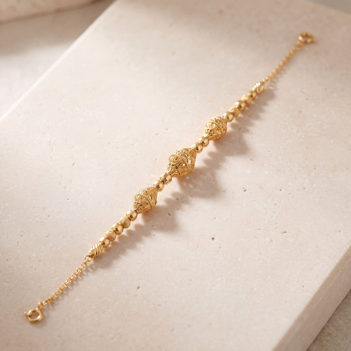 RP Beads & Ball Bracelet (D124) on travertine