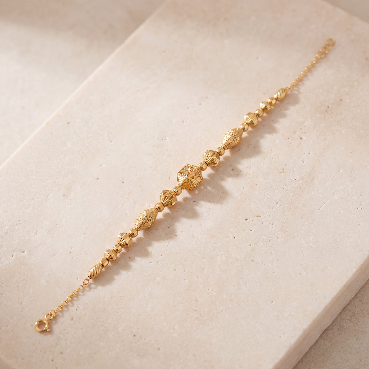 RP Beads & Ball Bracelet (D125) on travertine