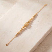 RP Beads & Ball Bracelet (D128) on travertine
