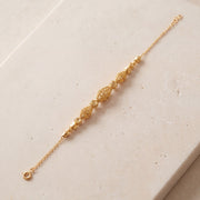 RP Beads & Ball Bracelet (D129) on travertine