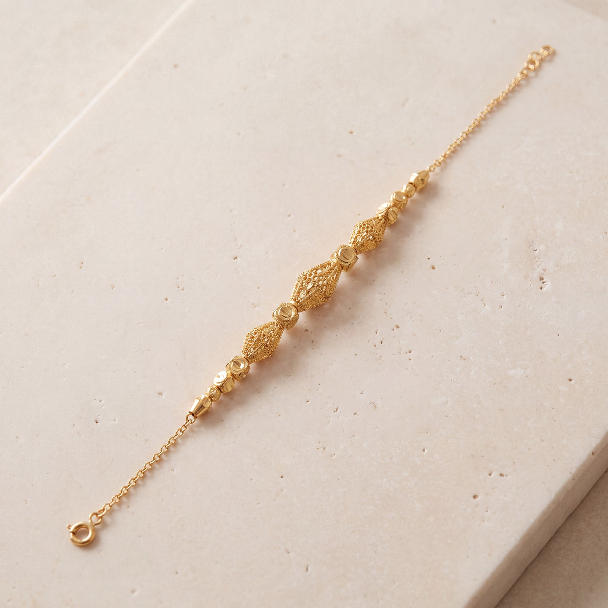RP Beads & Ball Bracelet (D129) on travertine
