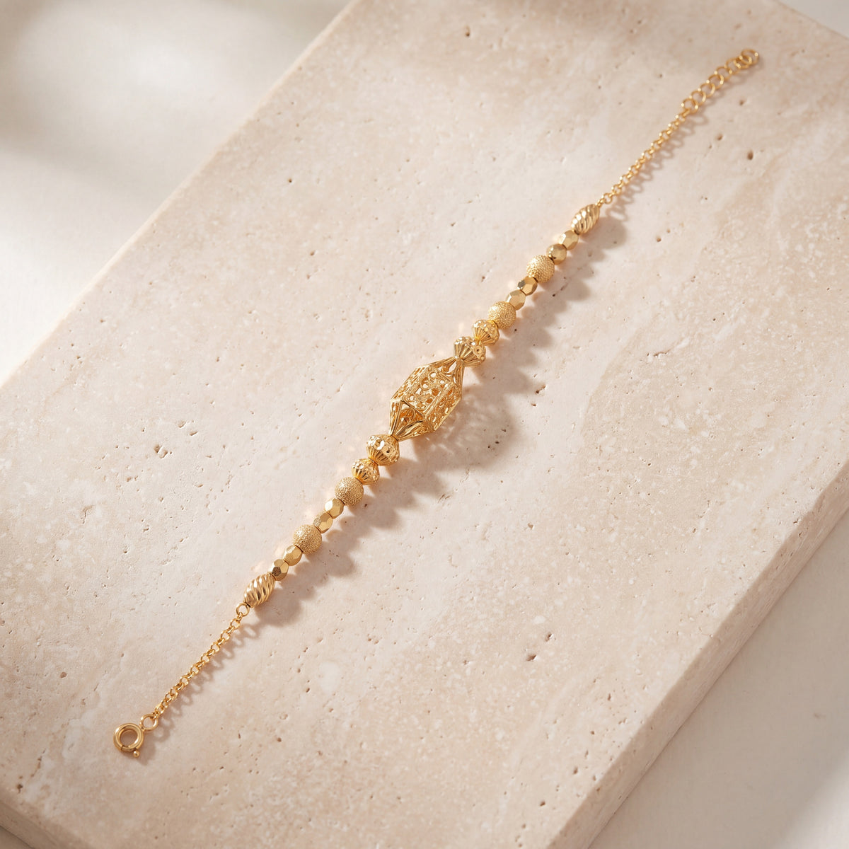 RP Beads & Ball Bracelet (D132) on travertine