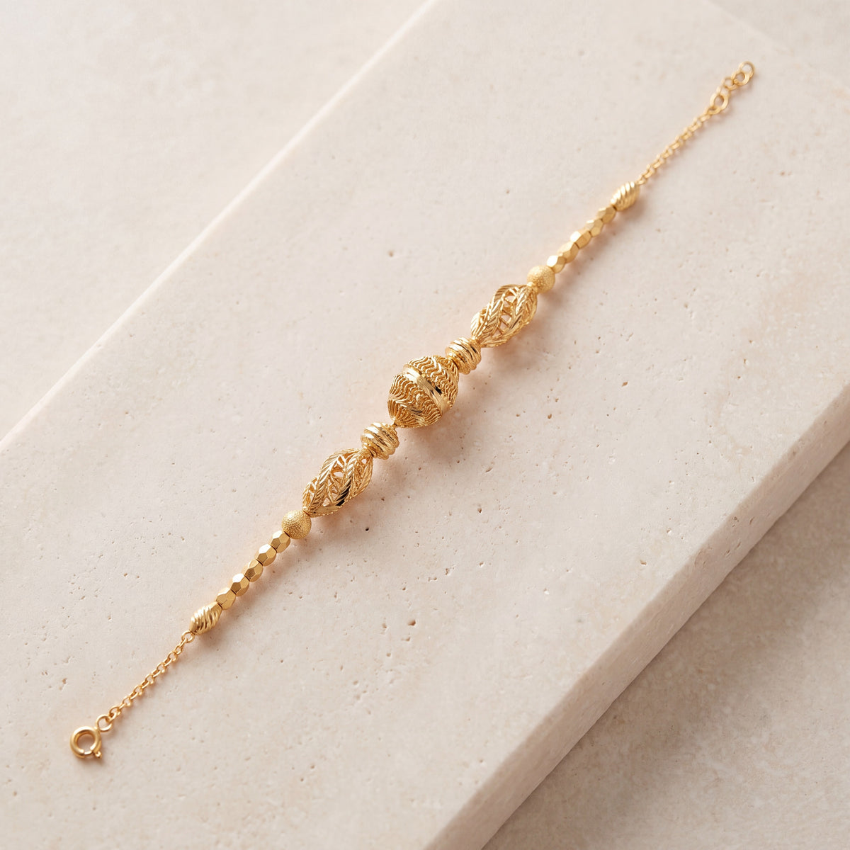 RP Beads & Ball Bracelet (D136) on travertine