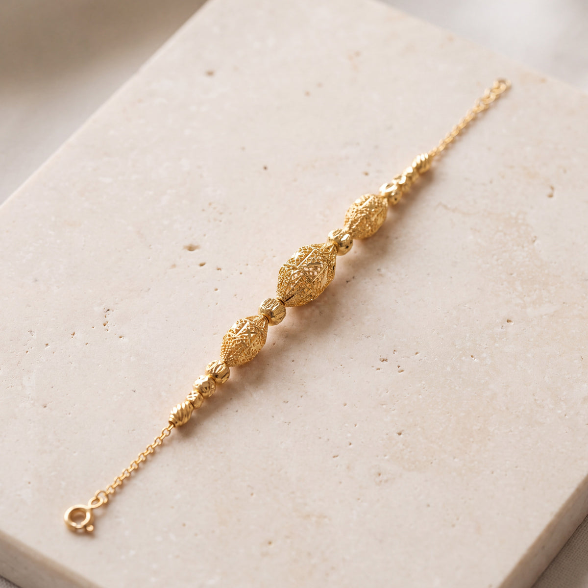 RP Beads & Ball Bracelet (D139) on travertine