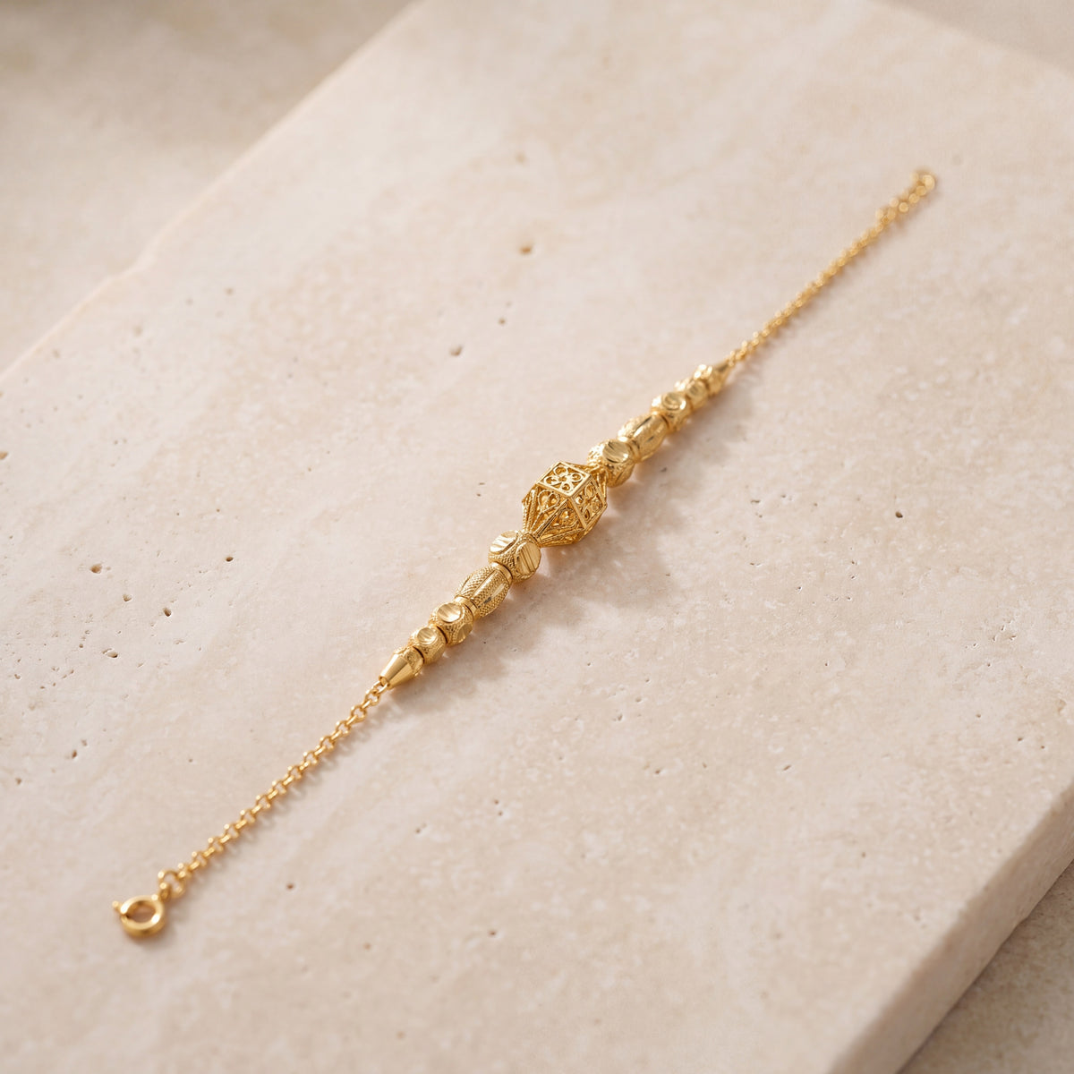 RP Beads & Ball Bracelet (D140) on travertine