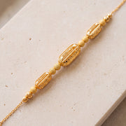 RP Beads & Ball Bracelet (D16) on travertine