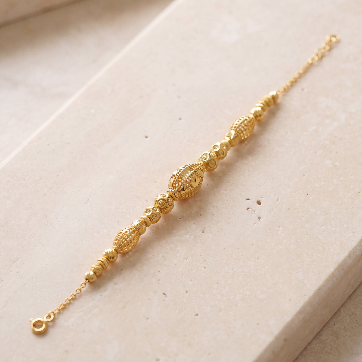 RP Beads & Ball Bracelet (D33) on travertine