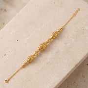 RP Beads & Ball Bracelet (D37) on travertine
