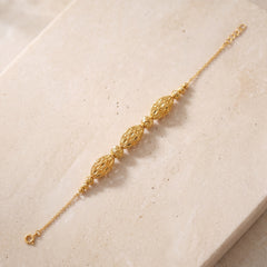 RP Beads & Ball Bracelet (D38) on travertine