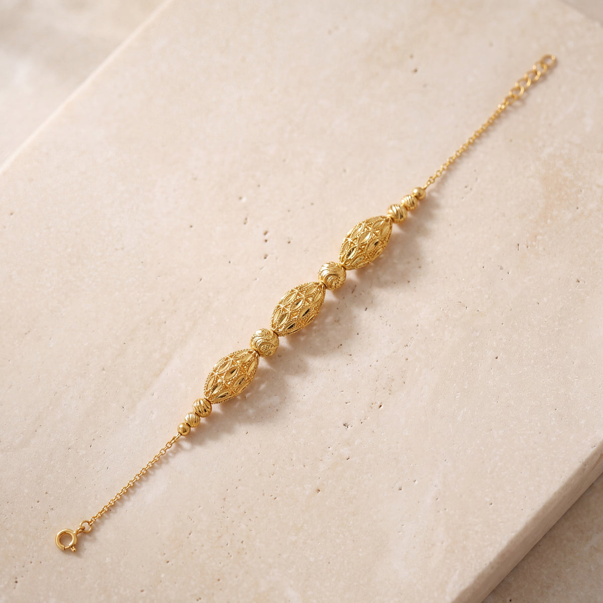 RP Beads & Ball Bracelet (D38) on travertine