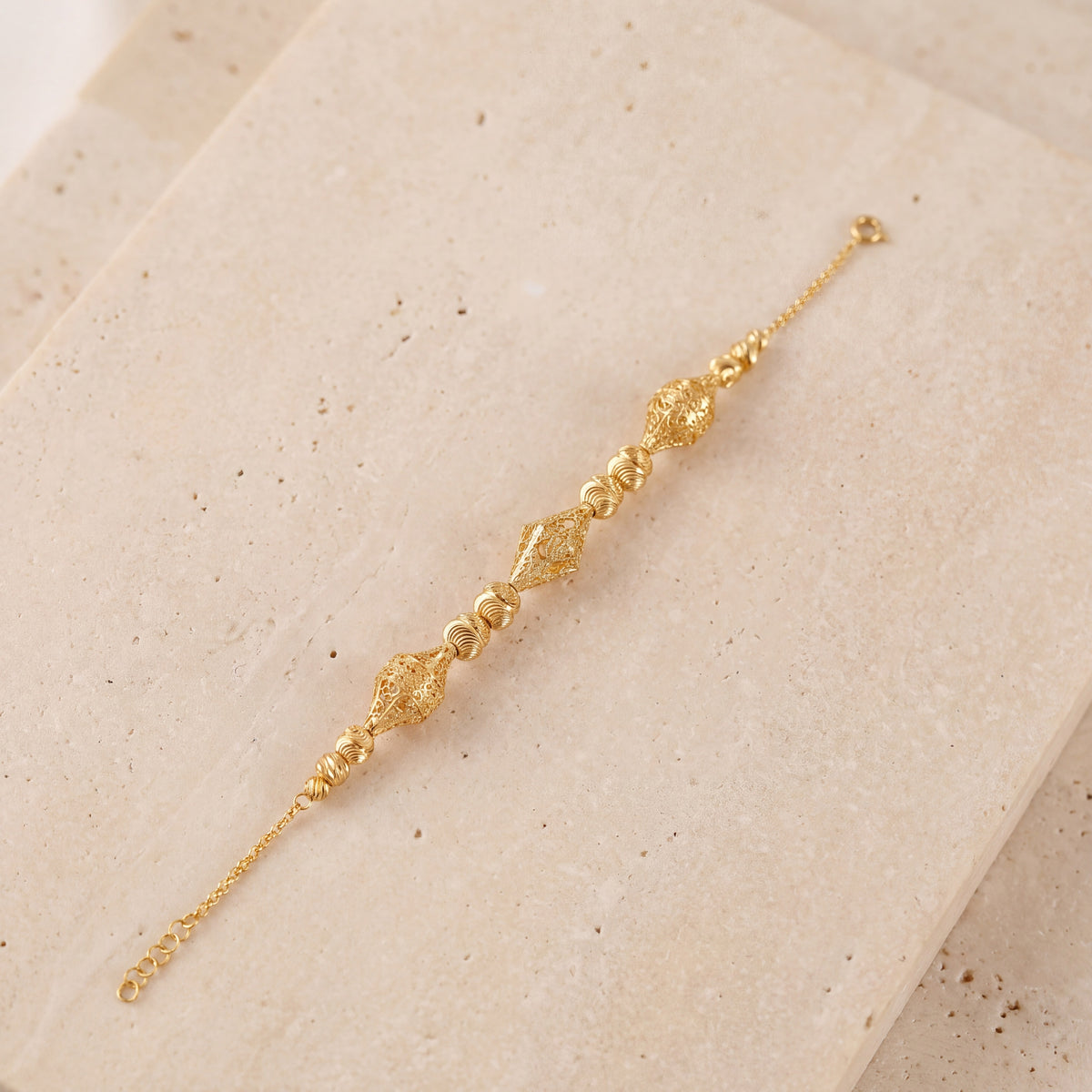 RP Beads & Ball Bracelet (D75) on travertine