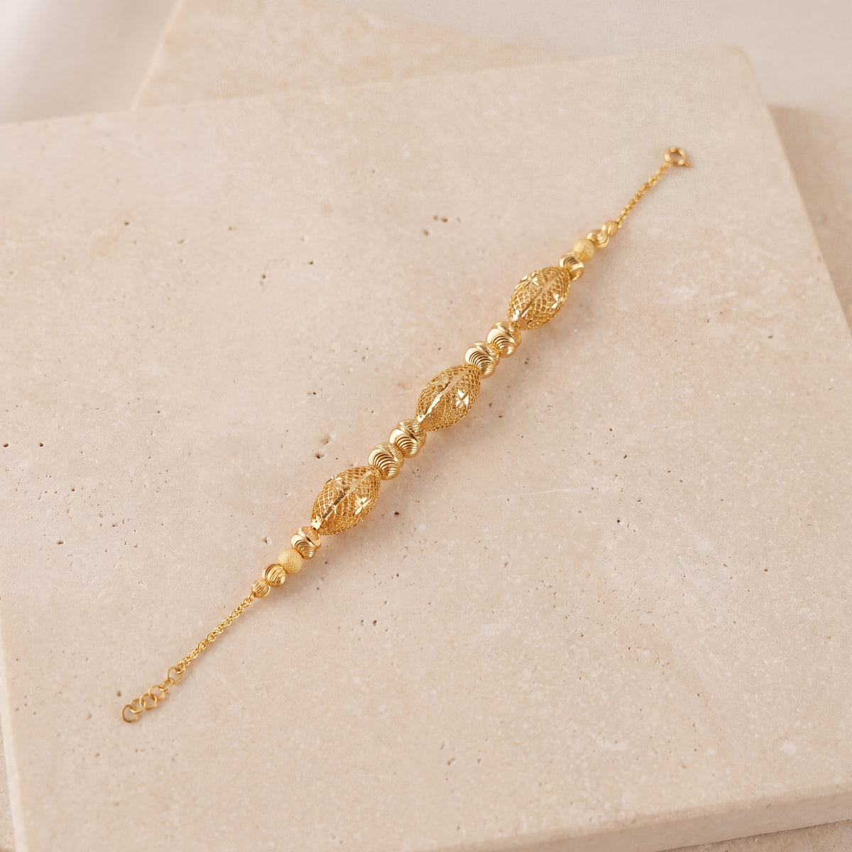 RP Beads & Ball Bracelet (D80) on travertine