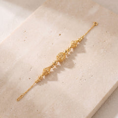 RP Beads & Ball Bracelet (D85) on travertine