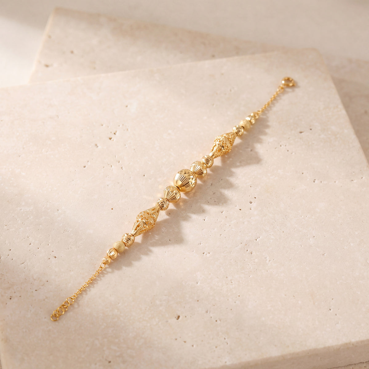 RP Beads & Ball Bracelet (D89) on travertine