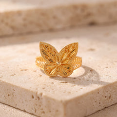 RP Diamond Cut Butterfly Ring (D1) on travertine