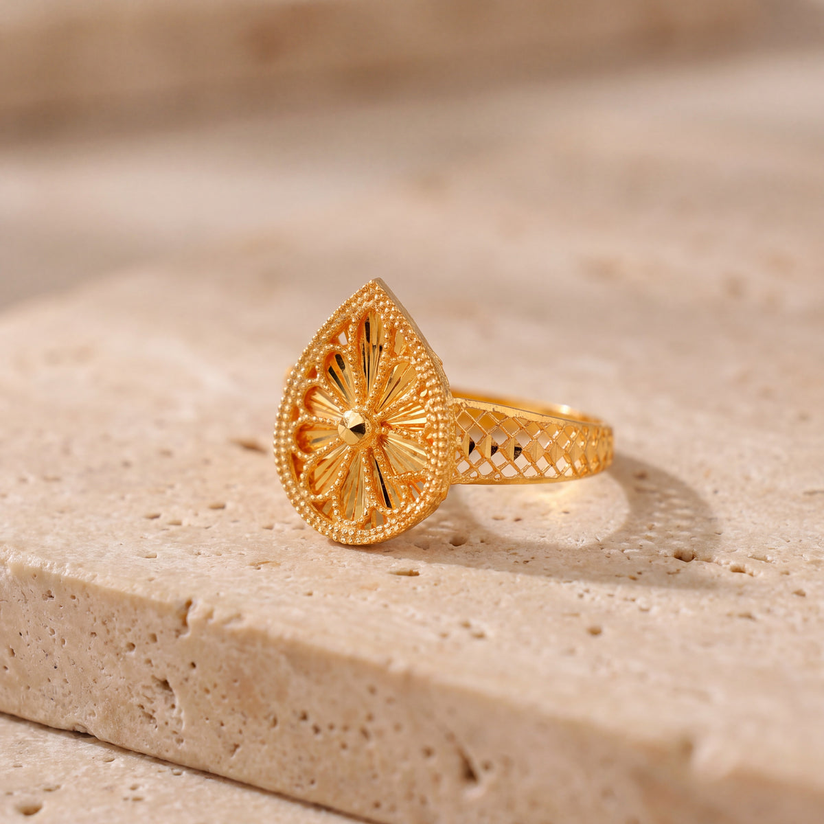 RP Diamond Cut Drop Ring (D1) on travertine