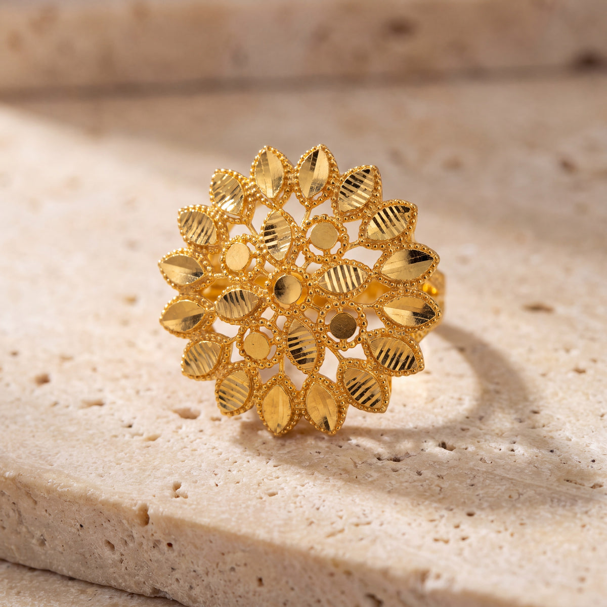 RP Flower Ring (D5) on travertine