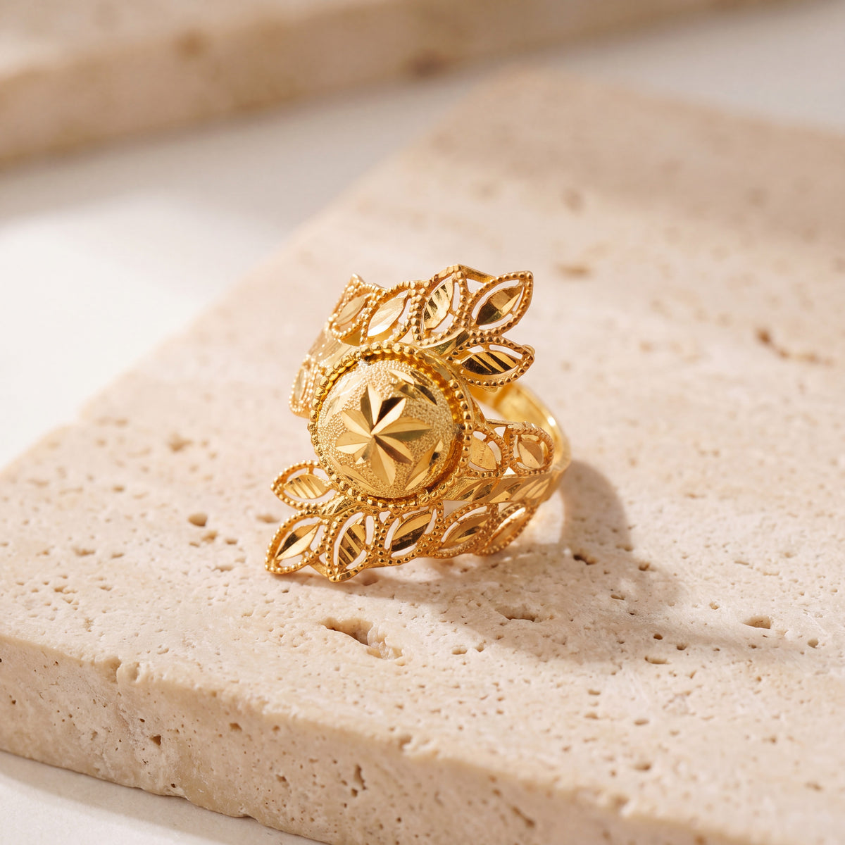 RP Leaf Ring (D9) on travertine