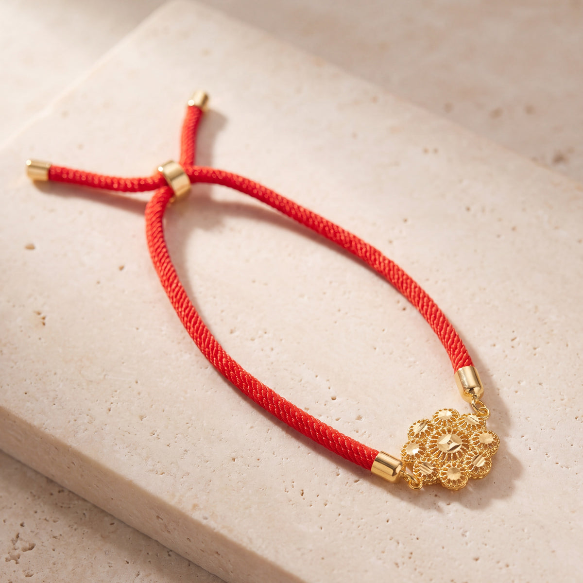 Scalloped Daisy Thread Bracelet on travertine