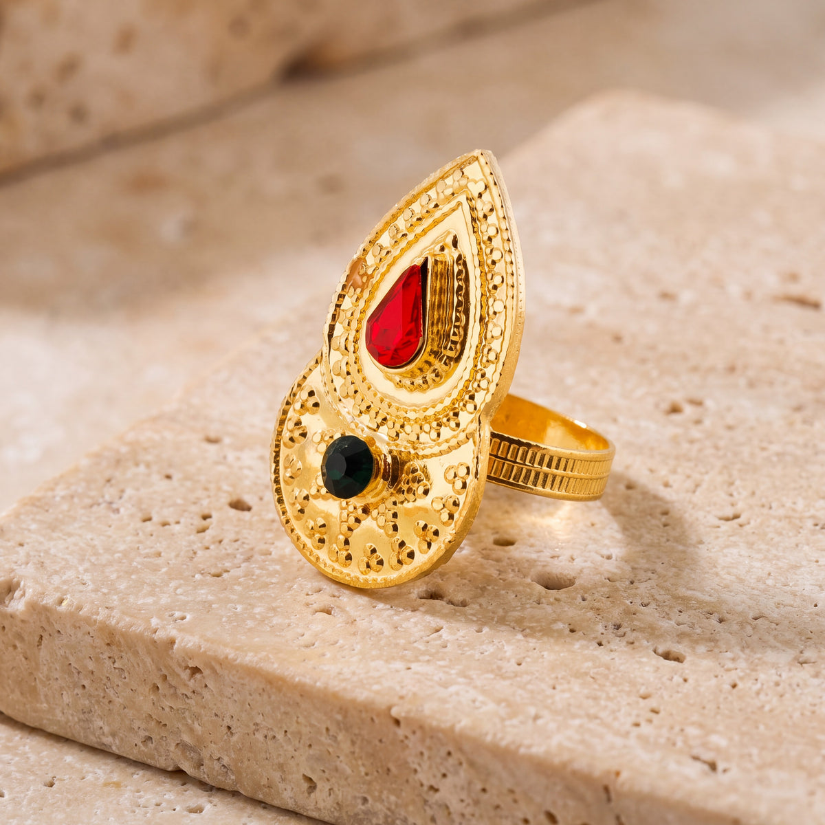 Shawahid Ring (D10) on travertine